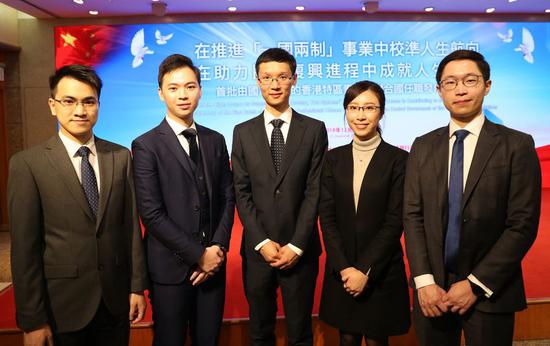 Five Hong Kong youths have a group photo at a ceremony held Dec. 23, 2019, in Hong Kong, China. Recommended by the Chinese government, they will work at the United Nations. (Xinhua/Wu Xiaochu)