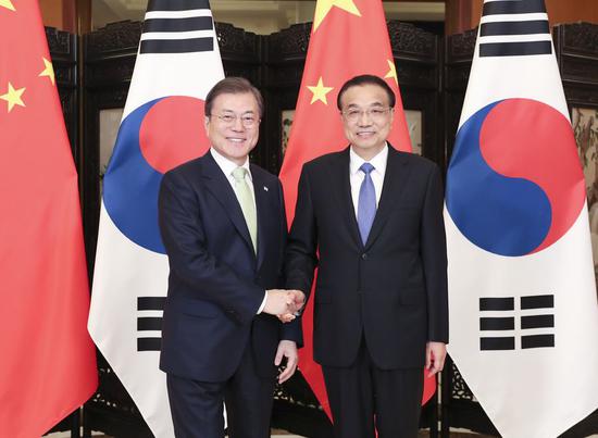 Chinese Premier Li Keqiang meets with President of the Republic of Korea (ROK) Moon Jae-in, who is here to attend the 8th China-Japan-ROK leaders' meeting, in Chengdu, southwest China's Sichuan Province, Dec. 23, 2019. (Xinhua/Ding Haitao)