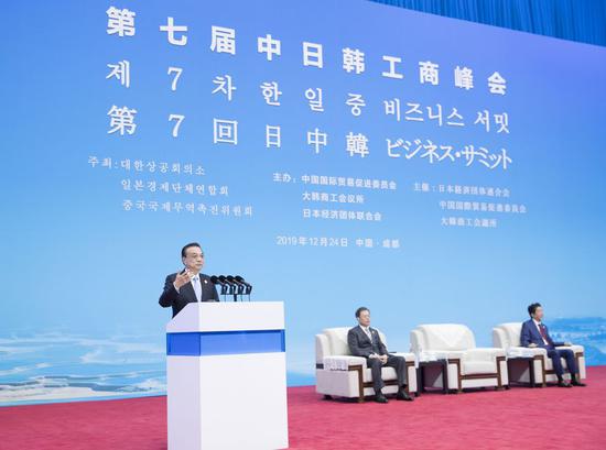 Chinese Premier Li Keqiang addresses the 7th China-Japan-Republic of Korea (ROK) Business Summit in Chengdu, southwest China's Sichuan Province, Dec. 24, 2019. Li attended the summit with ROK President Moon Jae-in and Japanese Prime Minister Shinzo Abe on Tuesday. (Xinhua/Wang Ye)