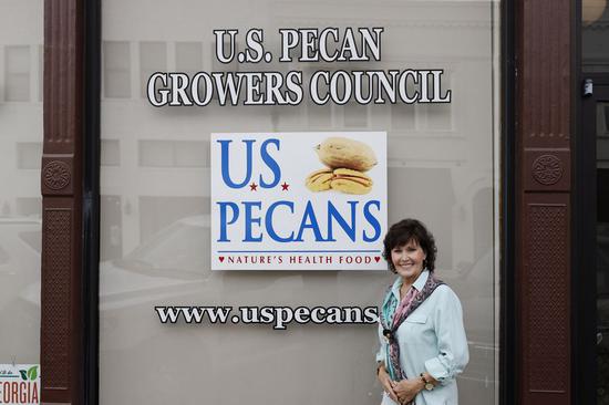 Janice Dees, executive director and international marketing manager of U.S. Pecan Growers Council, poses for a photo outside her office in Tifton, Georgia, the United States, Oct. 25, 2019. (Xinhua/Li Muzi)