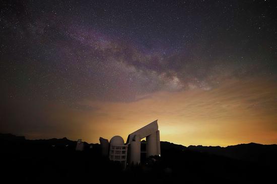 File photo shows the Large Sky Area Multi-Object Fiber Spectroscopic Telescope (LAMOST) under starry sky in Xinglong, in north China's Hebei Province. (Provided to Xinhua)