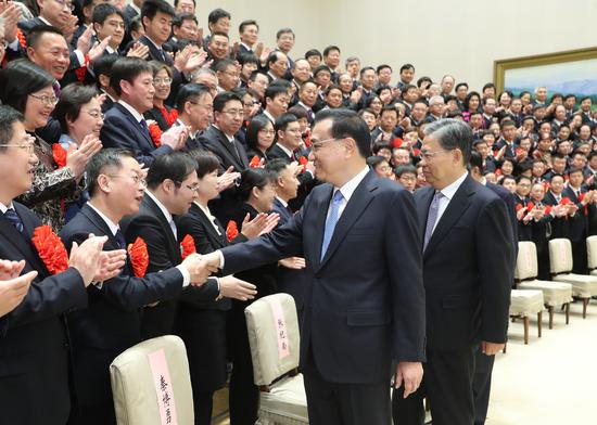 Chinese Premier Li Keqiang and Secretary of the Communist Party of China (CPC) Central Commission for Discipline Inspection Zhao Leji, both members of the Standing Committee of the Political Bureau of the CPC Central Committee and vice heads of the central auditing committee, meet with representatives of outstanding units and individuals of the country's auditing organs in Beijing, capital of China, Jan. 2, 2020. (Xinhua/Yao Dawei)