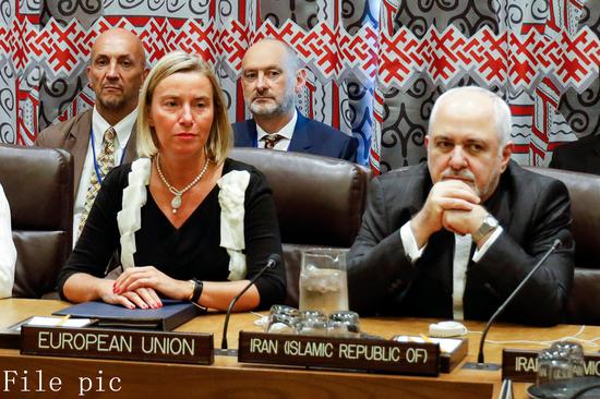 Federica Mogherini (L), EU foreign and security policy chief, and Iranian Foreign Minister Mohammad Javad Zarif (R), attend a meeting with foreign affairs officials from Britain, China, France, Germany and Russia at the UN headquarters in New York Sept. 25, 2019. (Xinhua/Li Muzi)