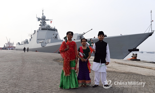 Pakistani children hold the national flags of China and Pakistan after the welcome ceremony for arriving Chinese warships at the port of Karachi on January 5, 2020. The joint exercise, codenamed Sea Guardians-2020, kicked off at the Pakistan Navy Dock Yard in Karachi, Pakistan on the morning of January 6, local time. (Photo/eng.chinamil.com.cn)