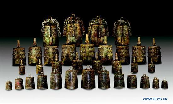File photo shows bronze chime bells excavated from a tomb of the Spring and Autumn Period (770-476 BC) in Suizhou City, central China's Hubei Province. （Phot0/Xinhua）