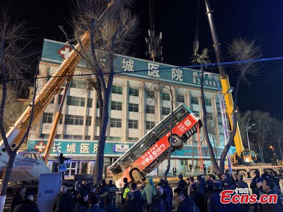 Bus crashes into sinkhole as road collapses in northwest China