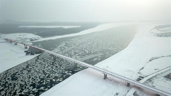 Aerial photo taken on Dec. 2, 2019 shows the first highway bridge connecting China and Russia across the Heilongjiang River.  (Xinhua/Wang Jianwei)