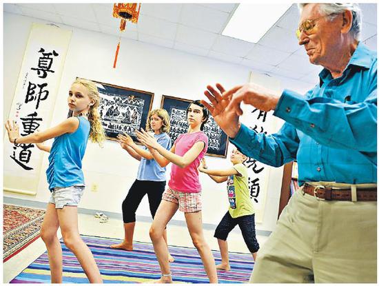 File photo: Children practice taiji at the Confucius Institute at the University of Maryland. (Photo/Xinhua)