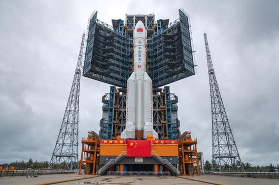 Carrier rocket Long March-5 Y3 is being vertically transported to the launching area of Wenchang Space Launch Center in south China's Hainan Province, Dec. 21, 2019. (Photo by Guo Wenbin/Xinhua)