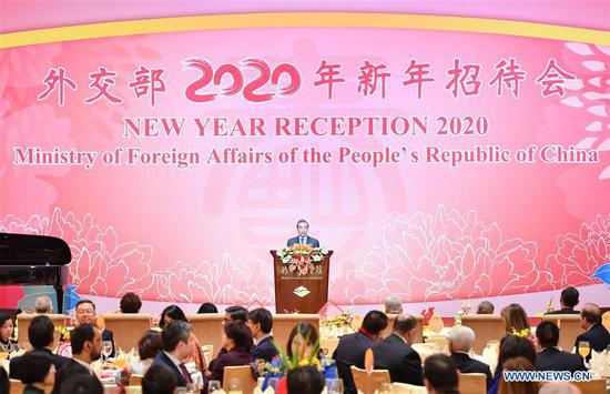 Chinese State Councilor and Foreign Minister Wang Yi addresses the 2020 new year reception of Chinese Foreign Ministry at the Diaoyutai State Guesthouse in Beijing, capital of China, Jan. 20, 2020. (Xinhua/Li Xiang)