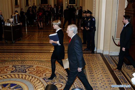 U.S. Senate Majority Leader Mitch McConnell (Front) heads to the Senate Chamber before the start of the Senate impeachment trial on Capitol Hill in Washington D.C., the United States, on Jan. 21, 2020. The impeachment trial against U.S. President Donald Trump kicked off Tuesday in the Senate as the chamber debated, and would later vote on, a resolution stipulating rules guiding the process. (Photo by Ting Shen/Xinhua)