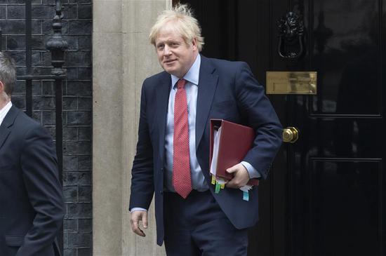 British Prime Minister Boris Johnson leaves Downing Street for Prime Minister's Questions at the House of Commons in London, Britain, on Jan. 22, 2020. (Photo by Ray Tang/Xinhua)