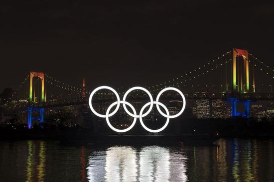 Olympic rings are illuminated during an event to mark six months before the opening of the Tokyo 2020 Olympic Games in Tokyo, Japan, on Jan. 24, 2020. (Xinhua/Christopher Jue)