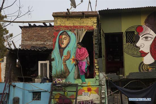 New Delhi slum given colorful makeover by local group