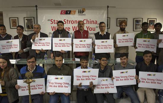 Participants hold placards during a special prayer meeting held for China in Noida, on the outskirts of New Delhi, India, Feb. 10, 2020. A special prayer meeting was held for China on Monday in Noida. The participants, mostly young students, came to express their solidarity with Chinese people -- especially the doctors and paramedical staff who are on the forefront working with dedication. (Xinhua/Javed Dar)