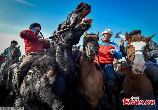 Kyrgyz riders compete in traditional horse game