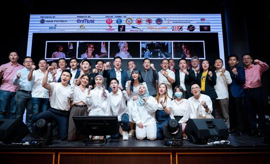 Malaysian music producer Ong Peng Chu (8th L, 2nd row), singers of the song 
