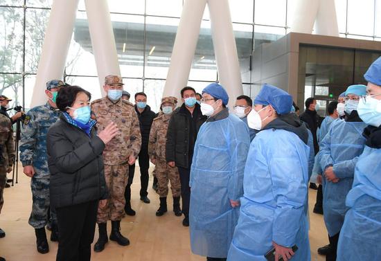 Chinese Vice Premier Sun Chunlan, also a member of the Political Bureau of the Communist Party of China Central Committee, visits the Taikang Tongji Hospital in Wuhan, central China's Hubei Province, Feb. 15, 2020. (Xinhua/Xiao Yijiu)