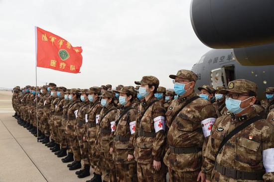 Military medics arrive at Tianhe International Airport in Wuhan, central China's Hubei Province, Feb. 13, 2020. (Xinhua/Li Yun)