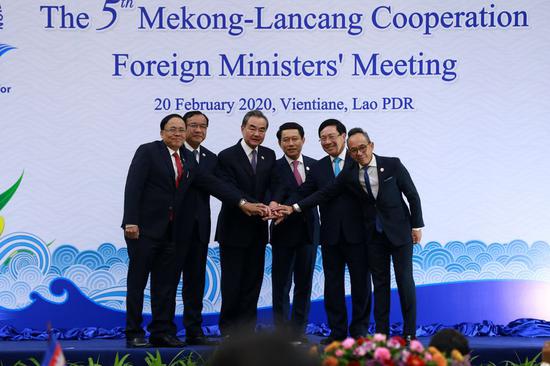 Chinese State Councilor and Foreign Minister Wang Yi (L3) and other five Mekong country foreign ministers take a group photo at the beginning of the fifth Lancang-Mekong Cooperation (LMC) Foreign Ministers' Meeting in Lao capital Vientiane on Feb. 20, 2020. (Xinhua/Kaikeo Saiyasane)