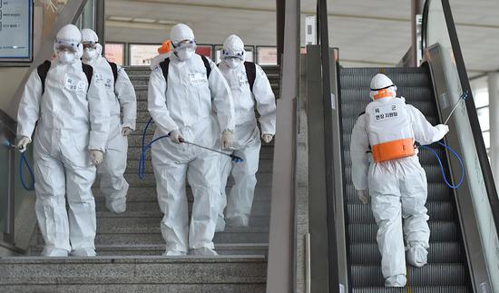 People disinfect a station in Daegu, South Korea, Feb. 29, 2020. (NEWSIS/Handout via Xinhua)