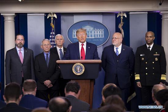 U.S. President Donald Trump (3rd R) and U.S. Vice President Mike Pence (3rd L) attend a press conference at the White House in Washington D.C., the United States, on Feb. 29, 2020. The United States on Saturday announced additional travel restrictions on Iran and raised travel advisories for certain areas of Italy and South Korea over coronavirus concerns. (Xinhua/Liu Jie)