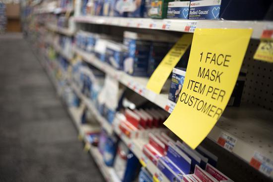 A notice of limiting sales of face masks is pictured at a pharmacy in New York City, the United States, March 7, 2020. (Xinhua/Li Muzi)