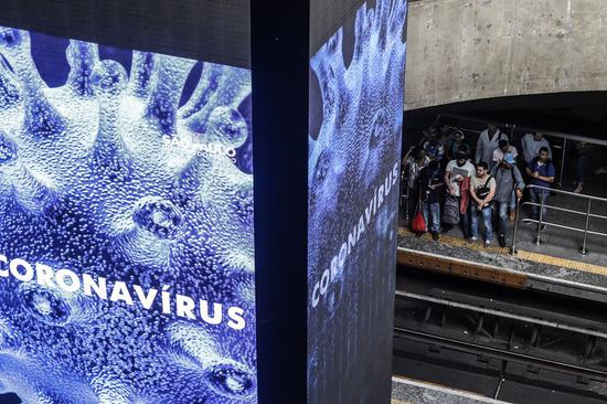 An electronic board displays information about COVID-19 at a subway station in Sao Paulo, Brazil, on March 11, 2020. (Photo by Rahel Patrasso/Xinhua)
