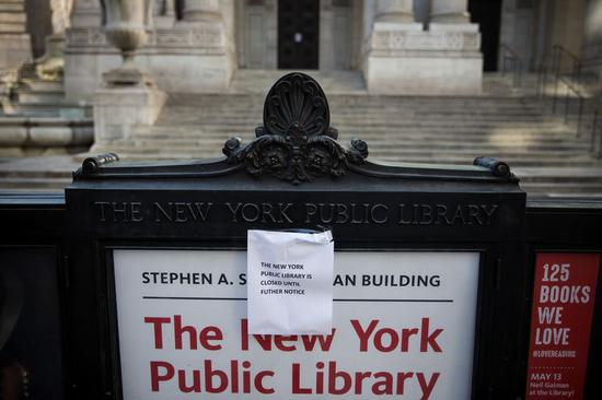 Photo taken on March 15, 2020 shows a notice announcing the closing of the New York Public Library in New York, the United States. (Photo by Michael Nagle/Xinhua)