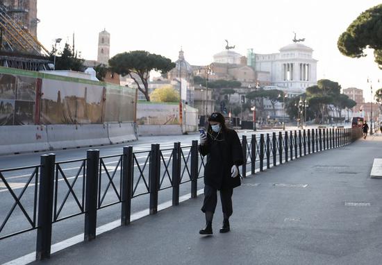 A woman is seen wearing a face mask in Rome, Italy, on March 16, 2020.(Xinhua/Cheng Tingting)