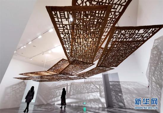 Visitors are seen at the exhibition in Shanghai, China, March 20, 2020. /Xinhua