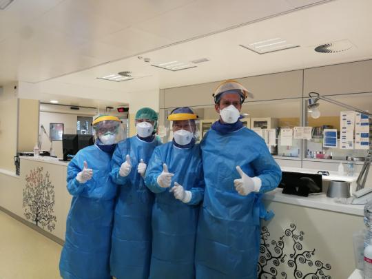 Chinese medical team experts and Italian doctors pose for a photo in Padua, Italy, on March 18, 2020. (Photo/Xinhua)