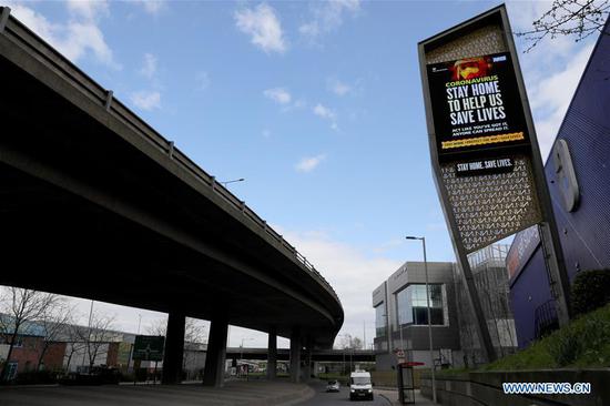 A digital billboard near the North Circular road displays a message urging people to stay home to slow the spread of the COVID-19, near London, Britain, on March 31, 2020. The number of confirmed cases of COVID-19 in Britain reached 25,150 as of Tuesday morning, an increase of 3,009 in 24 hours, according to the Department of Health and Social Care. (Photo by Tim Ireland/Xinhua)