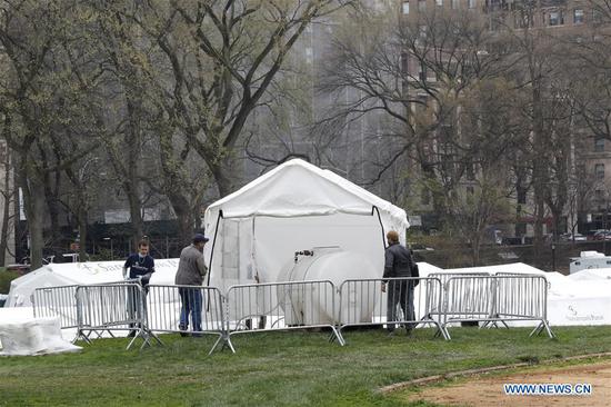 A temporary hospital is under construction in Central Park in New York, the United States, March 30, 2020. (Guang Yu/Handout via Xinhua)