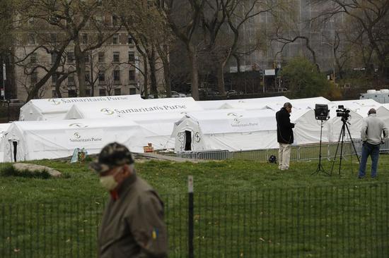 A temporary hospital is under construction in Central Park in New York, the United States, March 30, 2020. (Guang Yu/Handout via Xinhua)