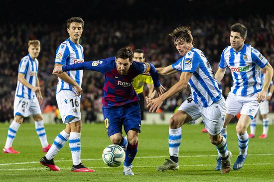 FC Barcelona's Lionel Messi (C) competes during a Spanish league football match between FC Barcelona and Real Sociedad in Barcelona, Spain, March 7, 2020. (Photo by Joan Gosa/Xinhua)