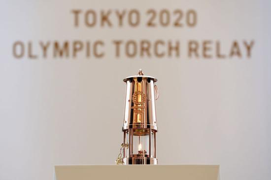 Photo taken April 1, 2020 shows the Olympic flame in a lantern at J-Village in Fukushima Prefecture, Japan. The flame will be on public display from April 2 to 30, due to the postponement of the Tokyo 2020 Olympic Games. (Tokyo 2020/Handout via Xinhua)