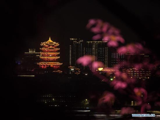 Aerial photo taken on April 7, 2020 shows the illuminated Yellow Crane Tower, or Huanghelou, a landmark of the city of Wuhan, central China's Hubei Province. (Xinhua/Xiao Yijiu)