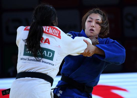 A judo match is competed between Japanese Nabekura Nami (R) and Agbegnenou Clarisse of France during the women's -63kg final match at the 2019 IJF World Judo Tour Qingdao Masters in Qingdao, east China's Shandong Province, Dec. 13, 2019 (Xinhua/Li Ziheng)