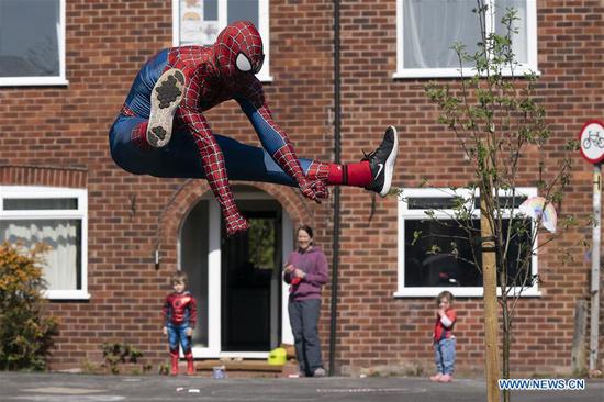 'Spider-Man' entertains public amid COVID-19 outbreak in Manchester, Britain