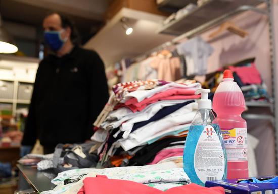 A shop selling children's products reopens in Rome, Italy, April 15, 2020. (Photo by Alberto Lingria/Xinhua)