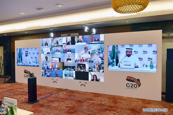 Photo taken on Apirl 19, 2020 in Riyadh, Saudi Arabia shows G20 health ministers attending a virtual meeting.  (G20 Saudi Arabia/Handout via Xinhua)