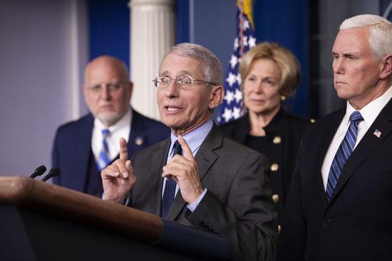 Anthony Fauci (front), director of the U.S. National Institute of Allergy and Infectious Diseases(NIAID), attends a press conference on the coronavirus at the White House in Washington D.C., the United States, on March 2, 2020. (Xinhua/Liu Jie)