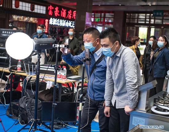 Merchants promote products via live broadcast in Wuhan, Hubei