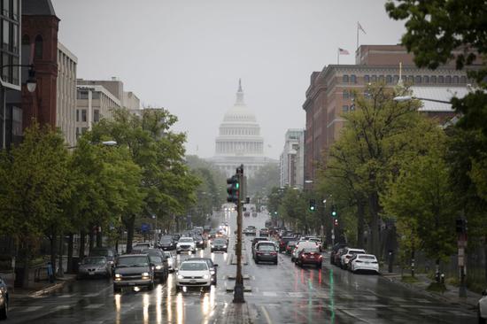 A street near the U.S. Capitol building is seen during rush hours in Washington D.C. April 23, 2020. (Photo by Ting Shen/Xinhua)