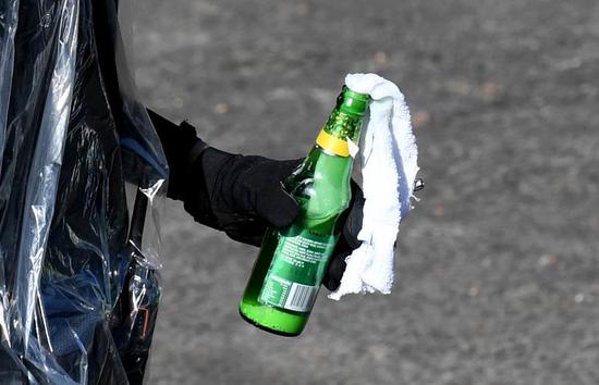 A rioter holds a petrol bomb outside the Hong Kong Polytechnic University in south China's Hong Kong, Nov. 17, 2019. (Xinhua)