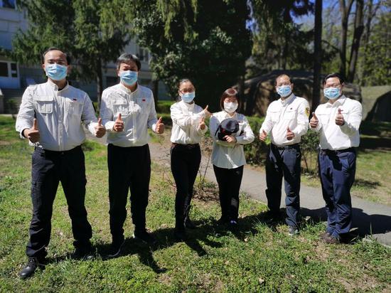 Members of Chinese medical expert team to Serbia pose for a group photo at their residence in Belgrade, Serbia, April 12, 2020. (Chinese medical expert team to Serbia/Handout via Xinhua)