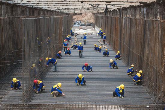 People work at a construction site of a utility tunnel in Wuhan, central China's Hubei Province, April 30, 2020. (Xinhua/Xiao Yijiu)