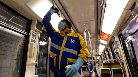 Staff members of a private cleaning and disinfection company disinfect metro trains in Vincennes near Paris, France, April 30, 2020. (Photo/Xinhua)