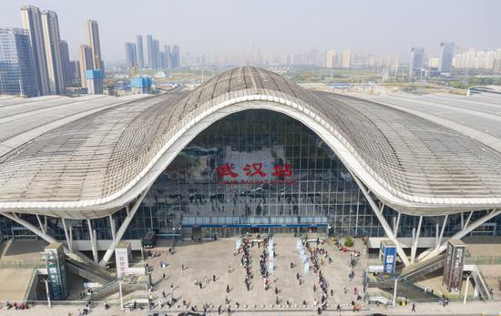 Aerial photo taken on April 8, 2020 shows passengers entering the Wuhan Railway Station in Wuhan, central China's Hubei Province. (Xinhua/Cai Yang)